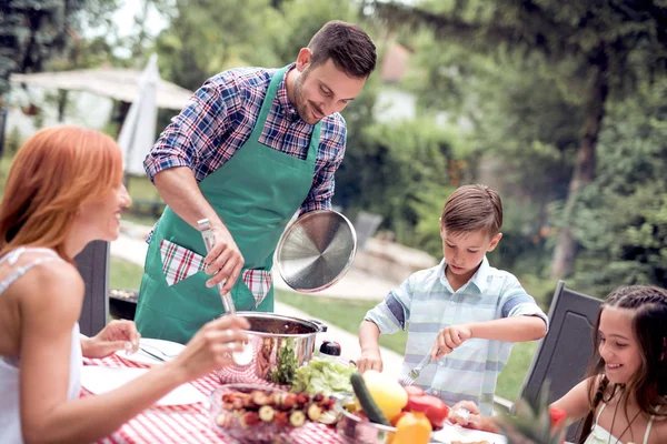 Young Family Having Barbecue Lunch Garden Sunny Day — Stock Photo, Image