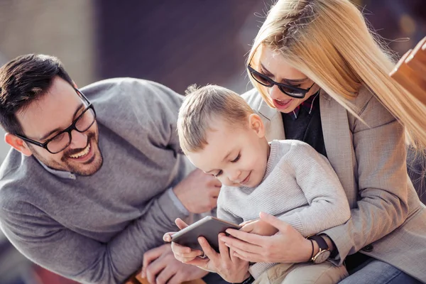 Family Watching Cartoon Outdoors Having Fun — Stock Photo, Image