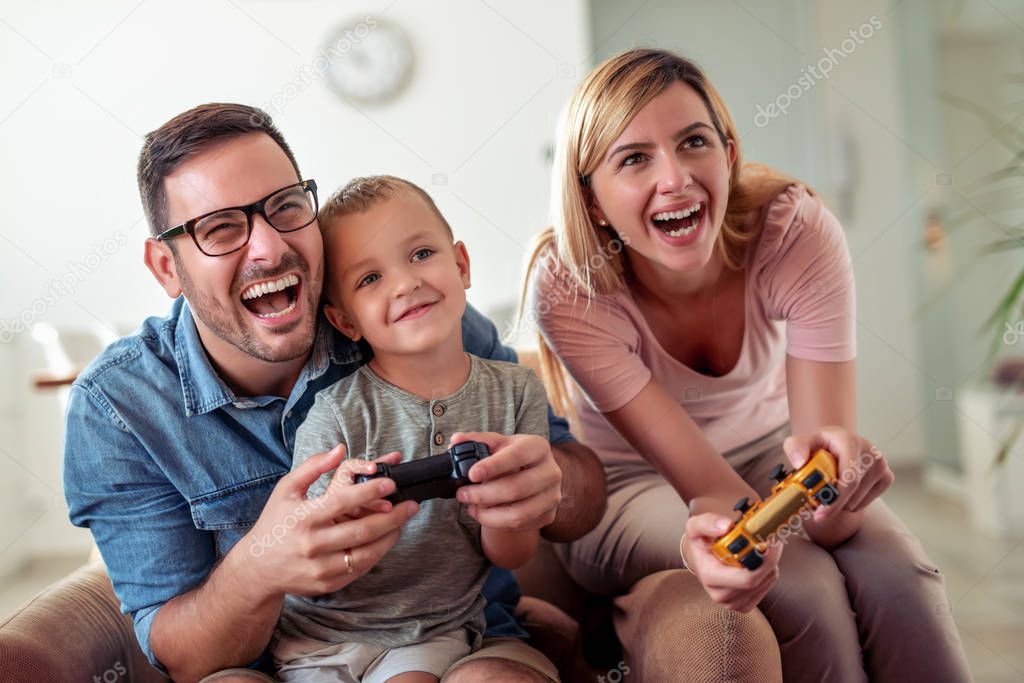 Happy family play video games together.Happy moments together.
