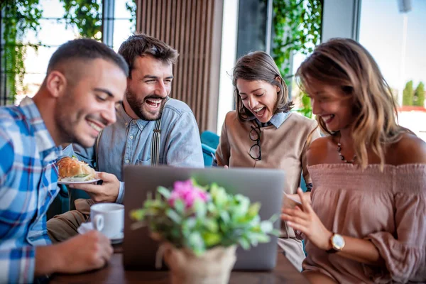 Happy Young People Sitting Restaurant Using Laptop Computer – stockfoto