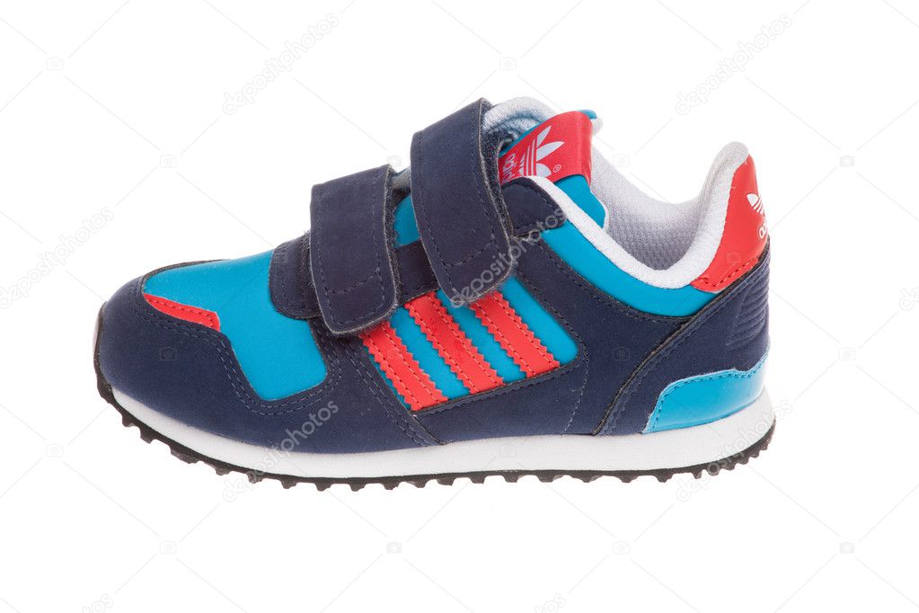 Varna , Bulgaria - APRIL 16, 2016 :ADIDAS ORIGINALS ZX 700 CF children shoe. Isolated on white. Product shot. Adidas is a German corporation that manufactures sports shoes, clothing and accessories