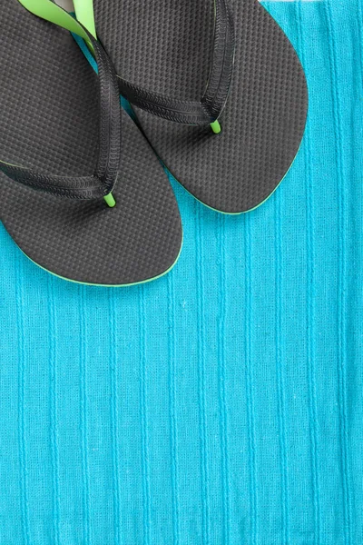 Flip-flops on blue color towel background — Stock Photo, Image