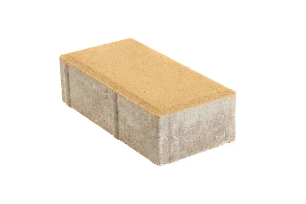 Single yellow pavement brick, isolated. Concrete block for paving — Stock Photo, Image