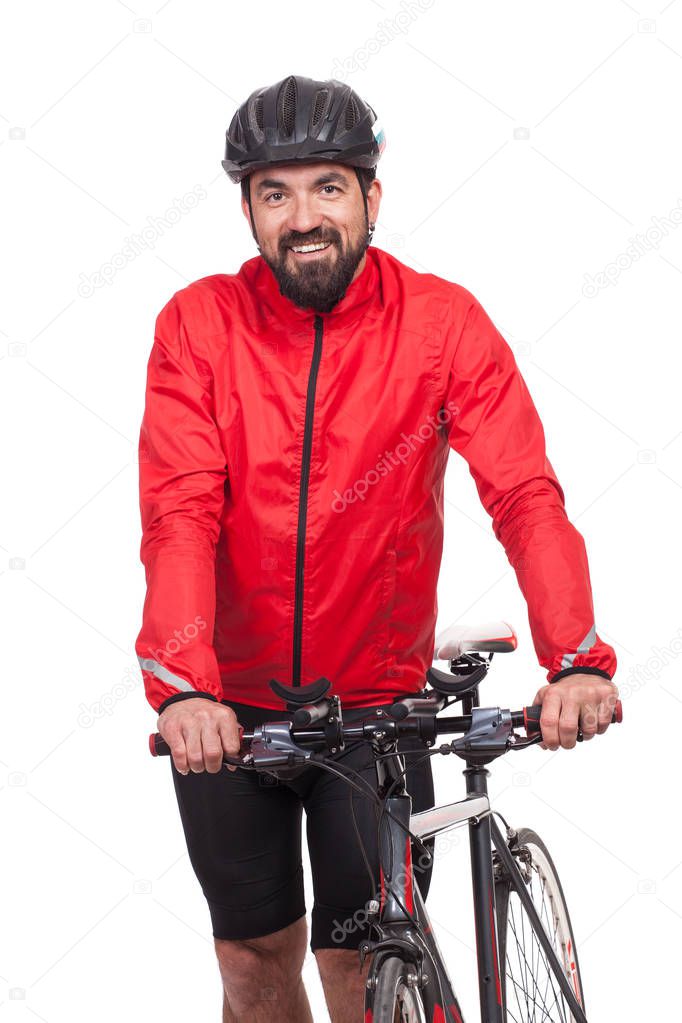 Portrait of smilling bicyclist with helmet and red jacket, posing next to a bicycle, isolated on white