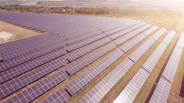 Aerial shot of photovoltaics solar farm. Solar farm power station from above. Ecological renewable energy. — Stock Photo, Image