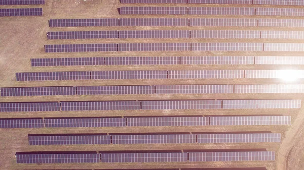Aerial shot of photovoltaics solar farm. Solar farm power station from above. Ecological renewable energy. — Stock Photo, Image