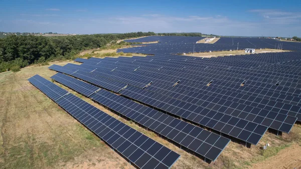 Aerial shot of photovoltaics solar farm. Solar farm power station from above. Ecological renewable energy. — Stock Photo, Image