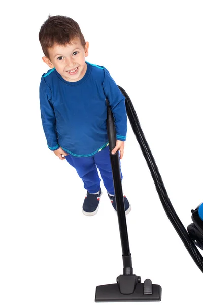 Smiling boy cleaning with vacuum cleaner, isolated on white — Stock Photo, Image