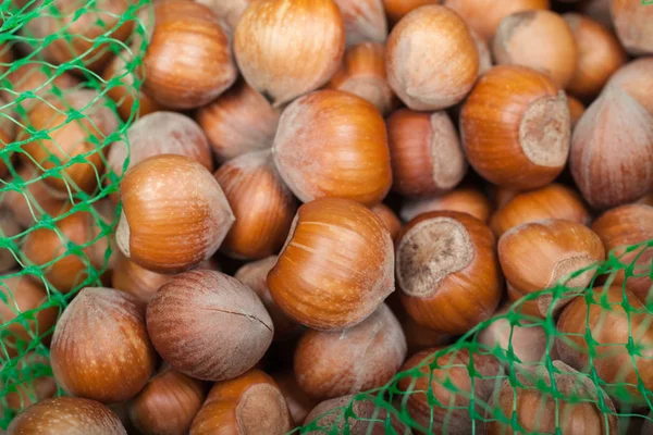 Stack of hazelnuts background — Stock Photo, Image