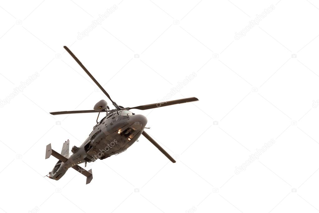 Military helicopter in flight, isolated on white