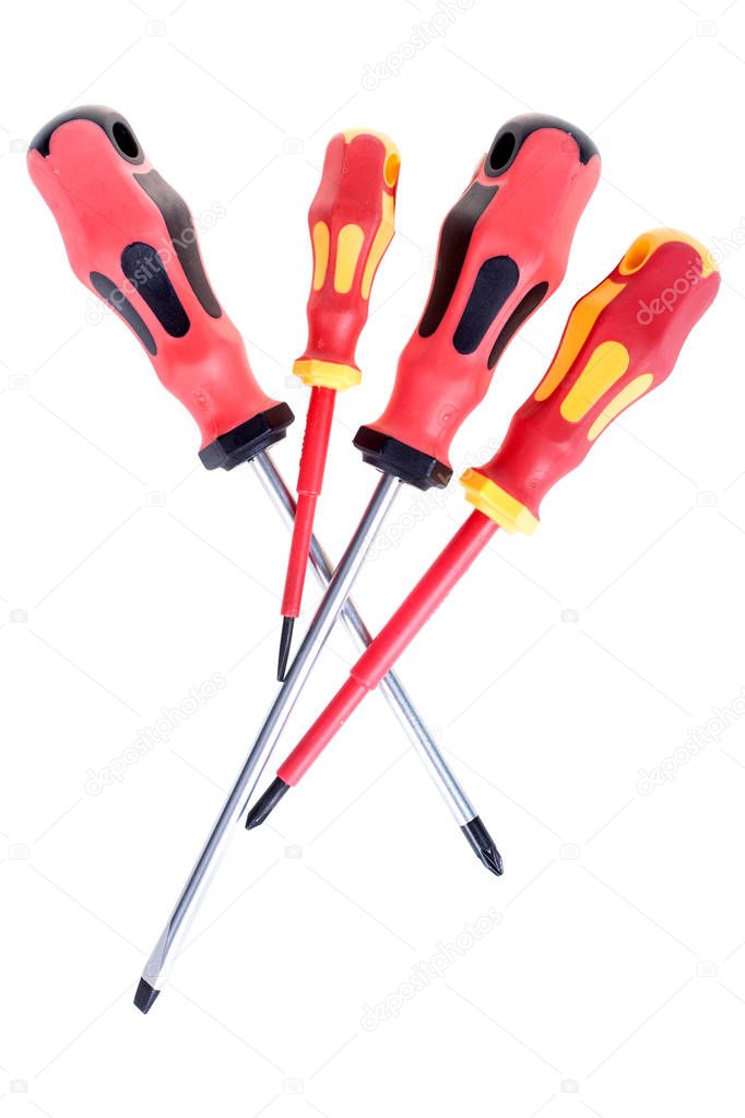 Set of four industrial screwdrivers with plastic handles, isolated on white
