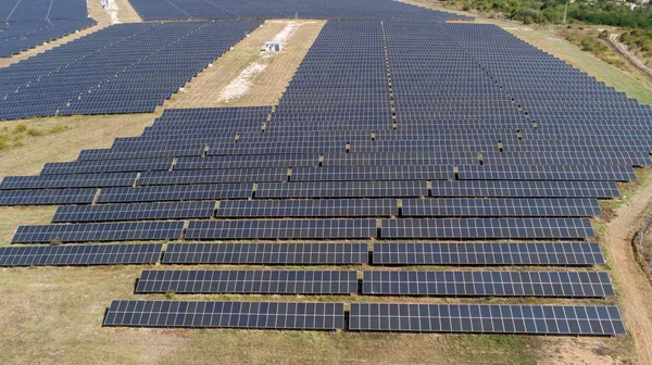 Aerial shot of photovoltaics solar farm. Solar farm power station from above. Ecological renewable energy. — Stock Photo, Image