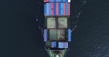 Large container ship at sea - Top down view.  Aerial top view of cargo container ship vessel import export container sailing.