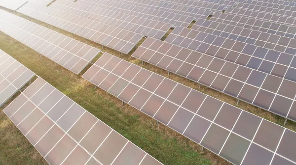 Aerial shot of photovoltaics solar farm. Solar farm power station from above. Ecological renewable energy.