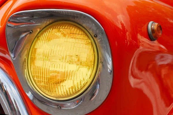 Headlight on orange retro car — Stock Photo, Image