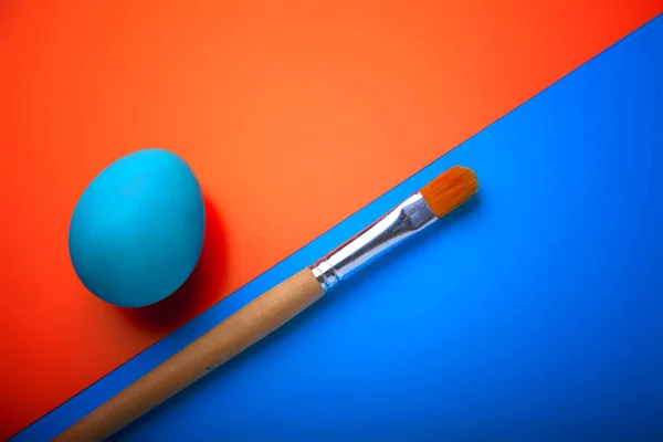 Easter egg and brush bright background,the concept of the creation of new