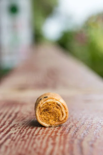 Crispy roll with dried shredded pork on a wood bar