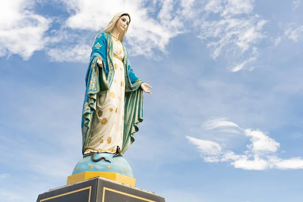 The Blessed Virgin Mary,mother of Jesus on the blue sky, in front of the Roman Catholic Diocese, public place in Chanthaburi, Thailand.