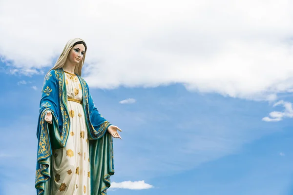 The Blessed Virgin Mary,mother of Jesus on the blue sky, in front of the Roman Catholic Diocese, public place in Chanthaburi, Thailand.