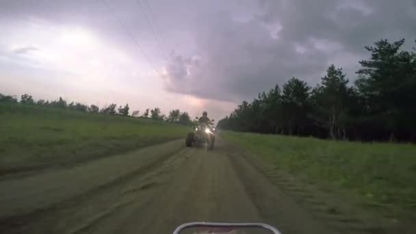 Boys ATV riding in the field. — Stock Video