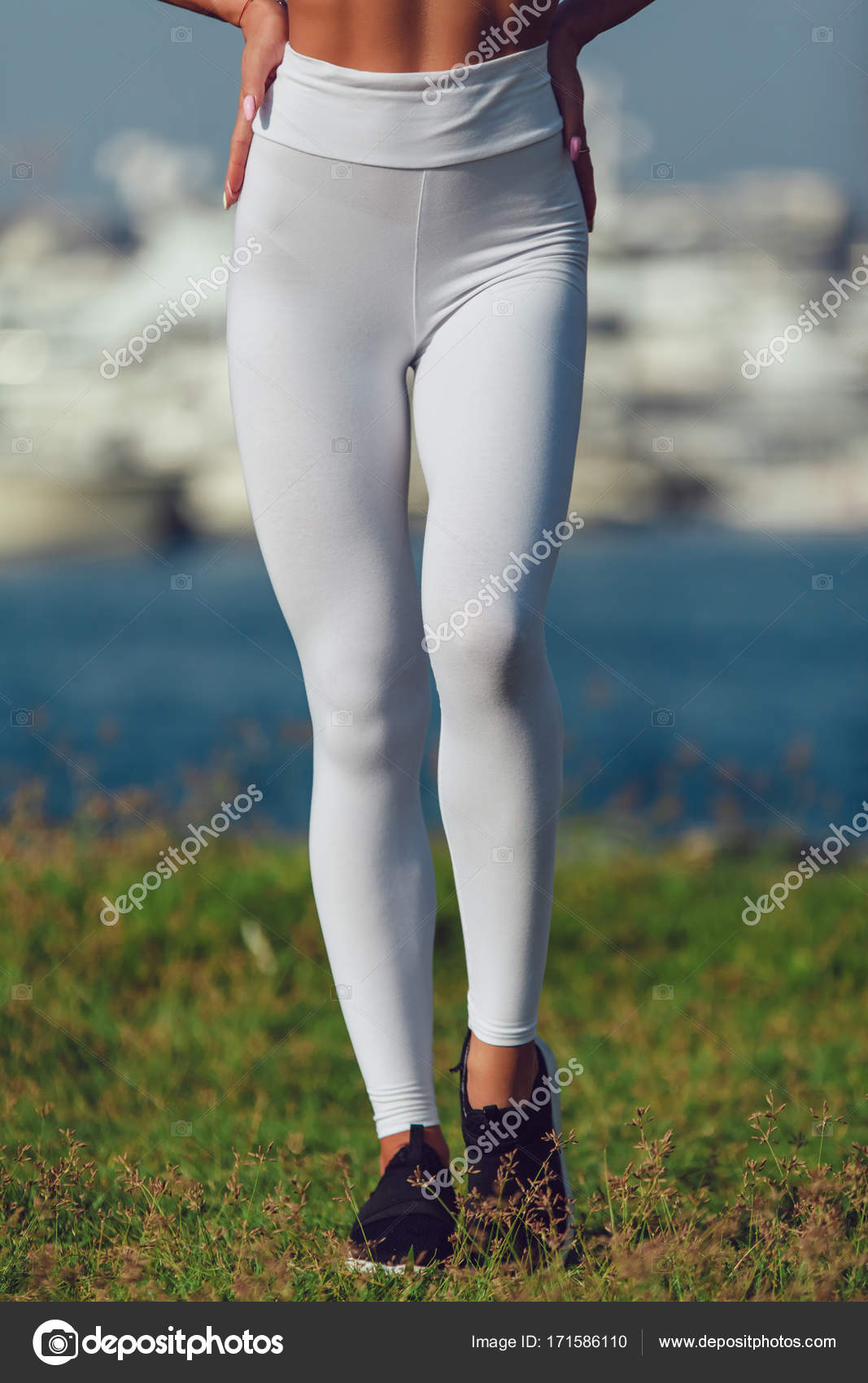 Legs of a sexy girl in white leggings. Mock-up. Outdoor. Stock