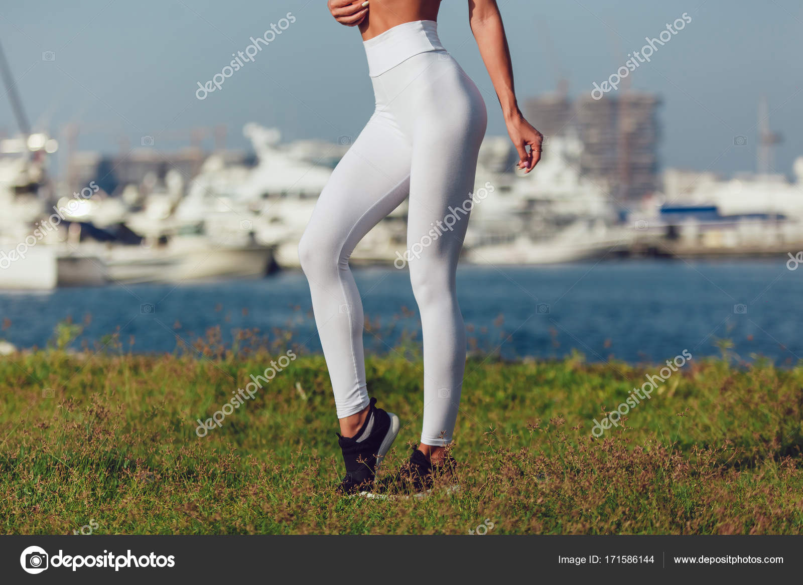 Legs of a sexy girl in white leggings. Mock-up. Outdoor gym. Stock Photo by  ©airkost 187784566