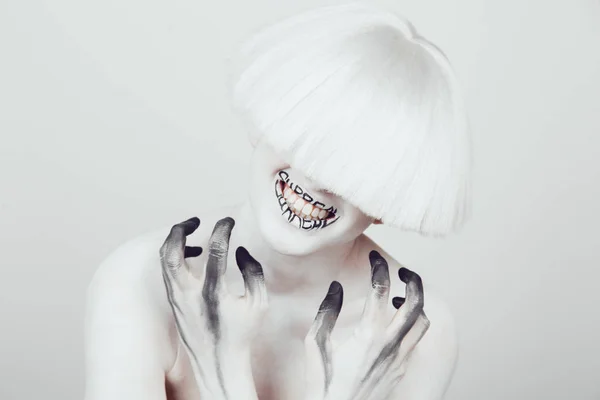 A girl with white skin and a white wig with an inscription on her lips surreal. — Stock Photo, Image