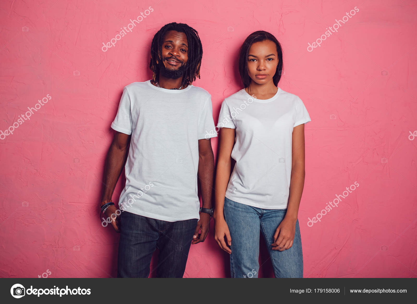 Download Beautiful African American couple in white t-shirts. Mock-up. — Stock Photo © airkost #179158006