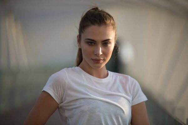 Portrait of an attractive girl with gathered hair.