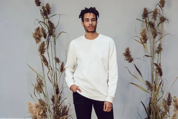 African american man wearing white blank sweatshirt. Mock-up.