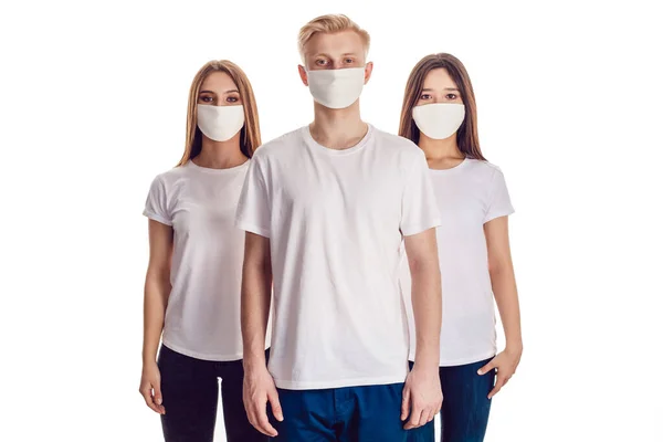 Group of people in face masks and in white t-shirts. — Stock Photo, Image