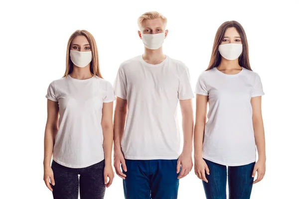 Group of people in face masks and in white t-shirts. — Stock Photo, Image