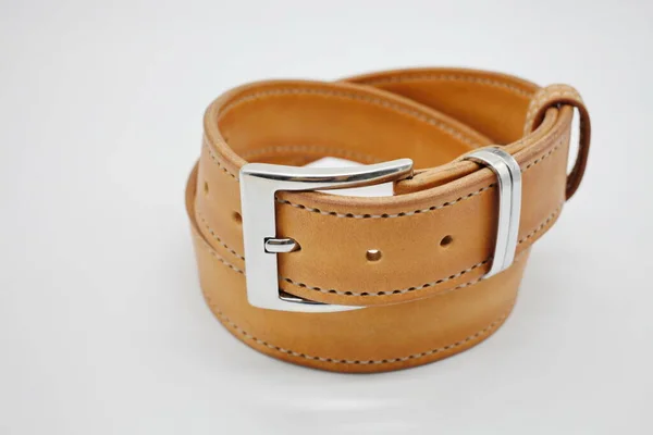 Sample of brown leather mens belt with metal shiny handmade buckle, stitched on the edge, hand craft concept — Stock Photo, Image