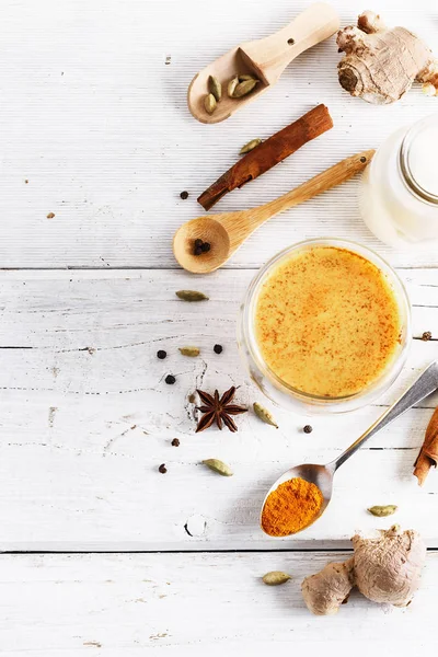 Top view image of turmeric latte and spices — Stock Photo, Image