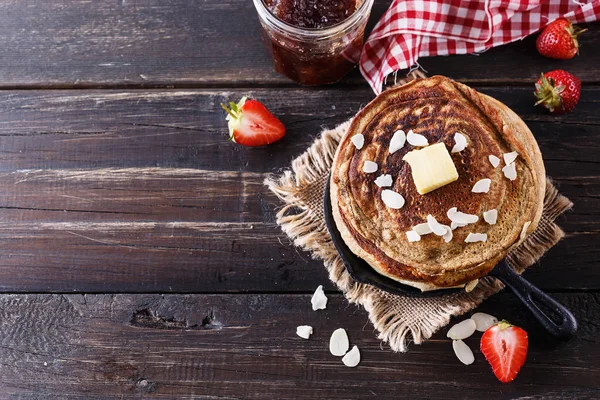 Pancakes over dark rustic background — Stock Photo, Image