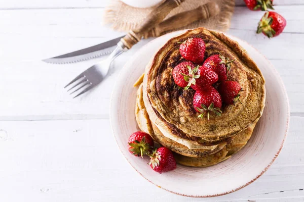Pancakes over white wooden background — Stock Photo, Image