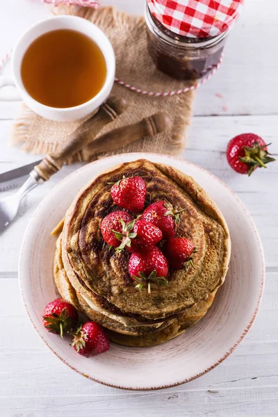 Pancakes over white wooden background — Stock Photo, Image