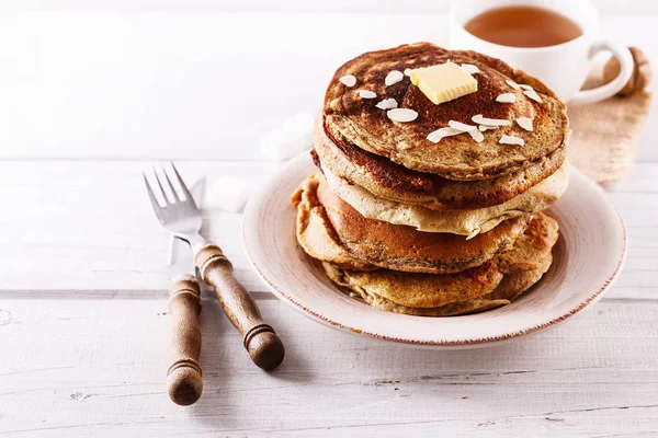 Pancakes over white wooden background — Stock Photo, Image