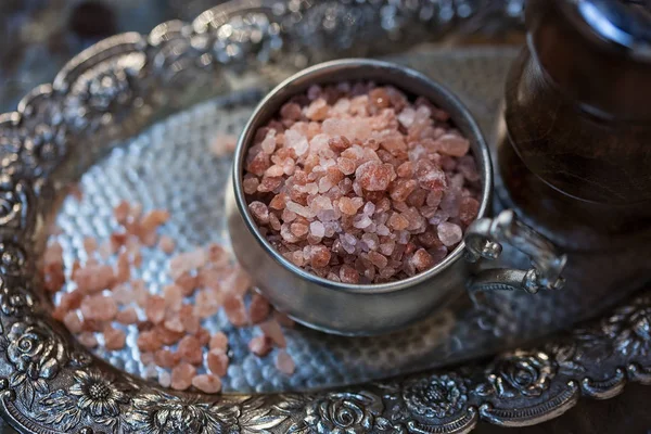 Close up image of Himalayan pink salt on a silver tray Stock Photo