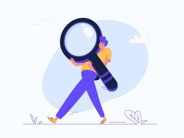 Genç adam ağır büyüteç taşıyor.