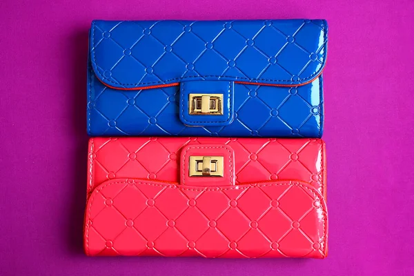 Lacquered women\'s wallets for cash and cards. Clutch colors pink, blue, fuchsia, purple.