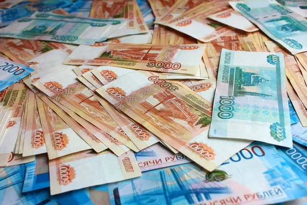 Russian money bills laid out background. Denominations of a banknote 5000 five, 1000 one and 2000 two thousand rubles.