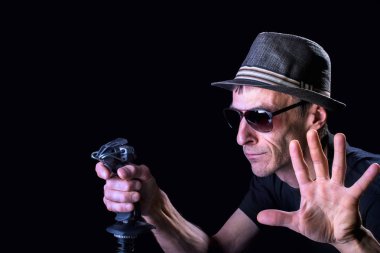 Middle-aged man playing computer games with joystick. 