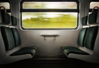 Empty seats in a train moving at high speed.