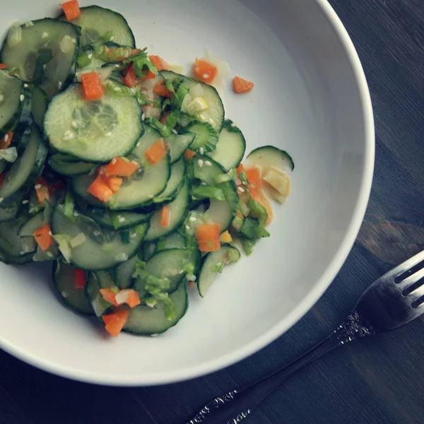 Chinese cucumber salad on the white plate Close up