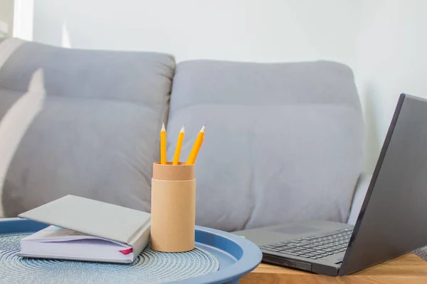 Home office of creative entrepreneur with black laptop — Stock Photo, Image