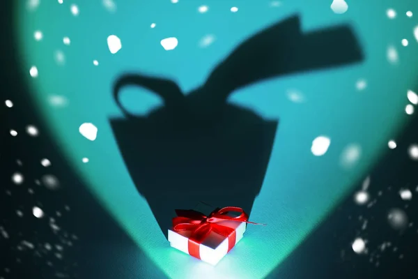 White box with a gift and a bow on mint background with a long shadow — Stock Photo, Image