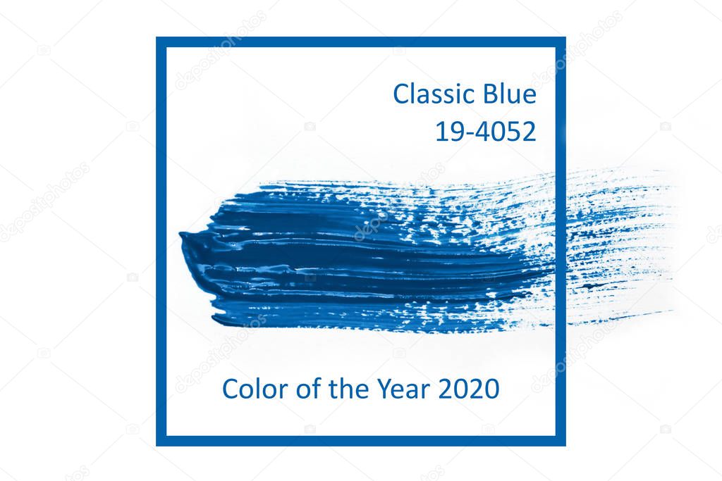 Classic Blue. Color of the Year 2020. Brush stroke of blue paint on white paper