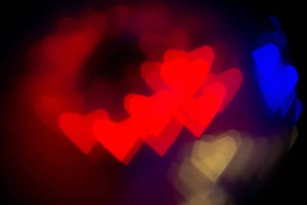 Contexte abstrait de la Saint-Valentin. Bokeh flou avec des cœurs colorés — Photo