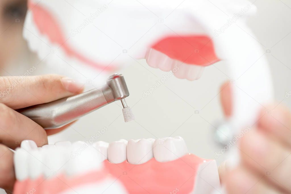 a reception in the dentist's office, cleaning the enamel of teeth